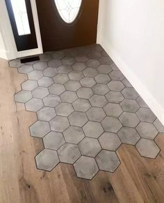 the floor is made up of hexagonal tiles and has a door in it