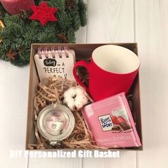 a box filled with assorted items next to a christmas tree and ornament