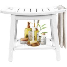 a white stool with soaps and lotions on it