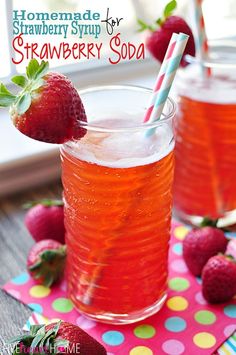 homemade strawberry syrup for strawberry soda in two glasses with strawberries on the side and polka dot napkin