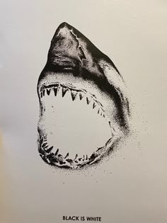 a black and white drawing of a shark's mouth with the words black is white on it