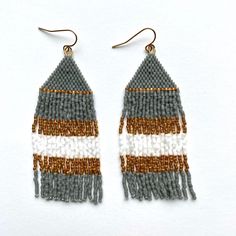 "Handmade with Miyuki Delica 11/0 seed beads. Gold plated ear wire. Approximately 3\" long and 1\" wide. Lightweight earrings. Each piece is designed by me and handwoven with care and attention to detail which can take several hours to complete.  SHIPPING: Tasha Jane Designs uses USPS Ground Advantage.  If needed in a quicker timeline, please message me. Shipping charges will be adjusted to reflect a different timeline. CARE INSTRUCTIONS:  I recommend beaded earrings are stored either in a hanging position or flat. It is recommended that you do not expose your jewelry to harsh chemicals or extended time in water as this may change the color of the beads.  If the fringe does not hang straight, hold the top of earring in one hand and gently roll each strand of fringe between fingers of other Gray Earrings, Lightweight Earrings, Bubble Envelopes, Seed Bead Earrings, Light Weight Earrings, Bead Earrings, Cute Earrings, Ear Wire, Seed Bead