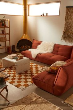 a living room filled with furniture and a fire place