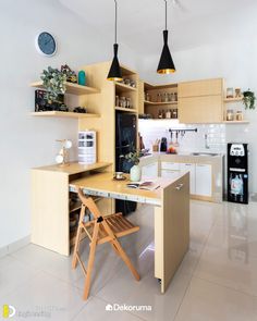 a kitchen with wooden cabinets and hanging lights