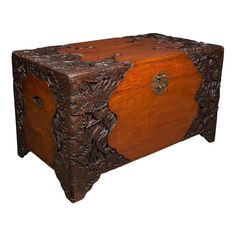 an old wooden trunk with carvings on the top and bottom, is shown against a white background