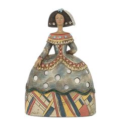 a ceramic figurine sitting on top of a table