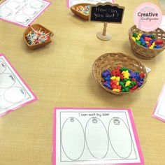 the table is covered with paper and crafting supplies for children to make their own crafts