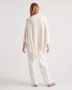 We love when an outfit comes together so easily. This baby-soft cashmere poncho adds some low-key luxe to your fave denim, leggings, and more. It all starts with 100% grade-A Mongolian cashmere, sourced sustainably and ethically from Inner Mongolia's Hircus goats. Layer up with three times the warmth of wool and quality that's made to last. Read more on what makes it special in our Cashmere 101.  | Quince | Women's Mongolian Cashmere Poncho in Ivory Chic Oversized Cashmere Cape, Chic White Cape For Spring, Chic Cashmere Poncho For Layering, Chic White Poncho For Fall, Chic White Fall Poncho, Chic White Cape For Fall, Cozy White Cape For Fall, 100 Grade, Contemporary Wardrobe