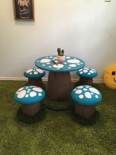 the table and stools are made to look like toad's foot prints on grass