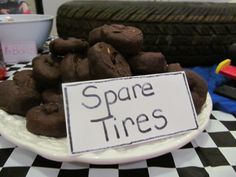 a plate with some cookies on it and a sign that says spare tires in front of them