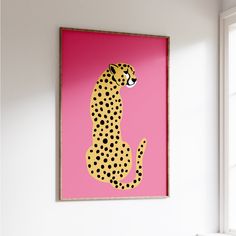 a pink wall with a painting of a cheetah on it's side