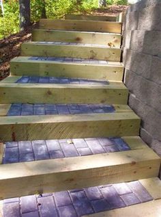 some steps made out of wooden boards in the woods