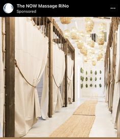 a long hallway with white walls and curtains