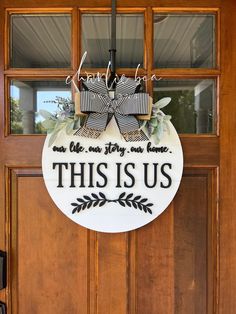 this is us sign hanging on the front door