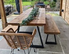 a wooden table sitting on top of a patio