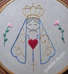 a cross stitch embroidery pattern with a princess's dress and heart in the center