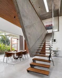 the stairs are made of concrete and wood