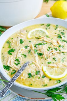 a white bowl filled with chicken and lemon soup