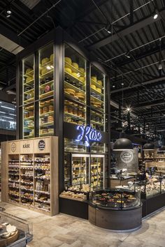 the inside of a deli filled with lots of food