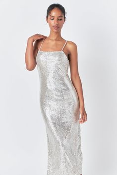 Introducing our stunning Sequin Slip Dress, perfect for any occasion this season. This elegant dress features a sleek sequin design that will make you stand out from the crowd. The dress is made from high-quality materials, ensuring optimum comfort and long-lasting wear. The design adds a touch of modernity to the classic slip dress style. The dress hugs your figure in all the right places, highlighting your curves and giving you a confident, glamorous look. Elevate your wardrobe with this must- Jumpsuit Fall, Tweed Dress, Silver Dress, Heat Styling Products, Romper With Skirt, Tops Fall, Elegant Dress, Fall Dresses, Sequin Dress