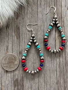 Navajo Pearls in Colorful Large Teardrop Earrings Handmade Navajo Artists exclusively for NPR and Western pearls. Gorgeous and bursting with Southwestern Colors! Made with 4, 5, and 6mm pearls ~ Beautiful blue turquoise.High-Grade Lapis Lazul, and Coral AcaiBaby Blue and Coral Acai Beads ~ Earrings Are On French Wires. 1 1/2” long measuring only the beads2" in length including French hook Free Shipping in the US :-) Arrives quickly in one of our signature blue gift boxes with a silk bow! This af Southwestern Colors, Pearl Teardrop Earrings, Navajo Pearls, Navajo Style, Silk Bow, Beads Earrings, Southwestern Jewelry, Blue Gift, French Wire