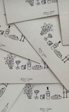 several cards with drawings of food and drinks on them, all lined up in rows