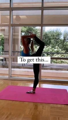 a woman is doing yoga in front of a window with the words to get this