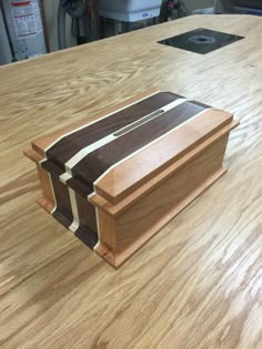 a wooden box sitting on top of a table