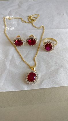 Classic Diana ring, earrings and pendant with chain set made with lab created synthetic Ruby cut and best 5A quality cubic zirconia. synthetic Ruby we have used is of exact same cut, color and quality as of natural ruby. Length of chain is adjustable from 16" inches to 18" inches. Ruby Cut - 9 mm x 11 mm Zirconia - 2.5 mm All  of our products are 100% skin-friendly and eco-friendly, does not contain nickel, cadmium, or lead. Base metal is guaranteed silver 925, stamped and marked and is real 18k White or Yellow gold filled which is very durable and stays for years. Gold Filling is completely different from Gold Plating as gold filling contains 100% gold which does not go away easily and enhances the life and look of the jewelry. Oval Cubic Zirconia Jewelry Set For Anniversary, Ruby Pendant Indian, Ruby Pendant Design, Ruby Necklace Indian Gold, Ruby Pendant Set, Indian Gold Necklace Designs, Diana Ring, Royal Indian, Gold Necklace Indian