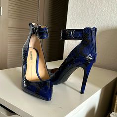 Brand New Never Worn Heels. Blue Snake Skin, Zip Up Back Chic Blue Ankle Strap Heels, Chic Blue Heels With Heel Strap, Blue Ankle Strap Heels For Evening, Blue High Heel Shoes With Heel Strap, Blue High Heels With 4-inch Heel, Blue High Heels With Heel Strap, Chic Blue Pointed Toe Heels, Blue 4-inch Heels, Blue Heels With 4-inch Heel For Night Out