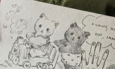 a drawing of two teddy bears sitting next to each other on top of a piece of paper