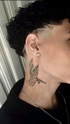 a woman with a bird tattoo on her neck