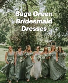 a group of women standing next to each other on top of a lush green field