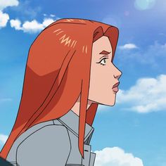 a woman with long red hair standing in front of a blue sky