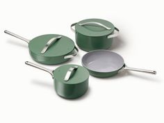 three green pots and pans on a white background