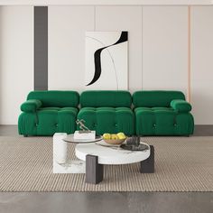 a living room with two green couches and a coffee table