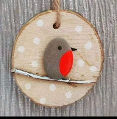 a wooden ornament with a bird on it