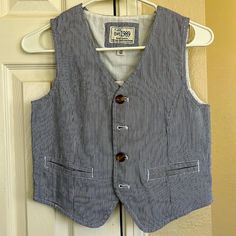 Brand New Boys Size 10 Blue And White Pin-Striped Button Down Vest. Casual School Outerwear With Buttons, Fitted Cotton Outerwear For School, Casual Cotton Vest With Snap Buttons, Navy Cotton Outerwear For School, Casual Navy Vest With Pockets, Cotton Button-up Vest, Blue Cotton Vest With Buttons, White Cotton Vest With Buttons, Blue Button-up Vest With Buttons