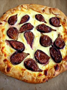 a pizza sitting on top of a pan covered in cheese and pepperoni toppings