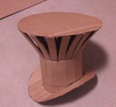 a small wooden object sitting on top of a table