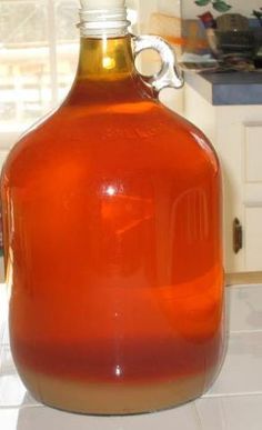 a large glass jug sitting on top of a counter