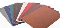 a set of five different colors of leathers on top of each other in various shapes and sizes