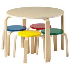 three stools and a round table with four different colored chairs on each side, against a white background