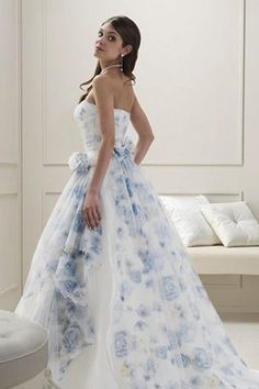 a woman in a white and blue wedding dress