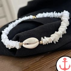 White Surf Necklace: Ride the Waves with Style Indulge your passion for the sea with our exquisite White Surf Necklace. Designed for the avid sea lover, this necklace is a stunning addition to our Surfer Necklace collection, capturing the essence of the ocean in its intricate design. Features of White Surf Necklace based on the Product Content High-Quality Materials: The White Surf Necklace is crafted with precision using premium materials, ensuring durability and long-lasting beauty. Elegant De White Shell-shaped Necklace For Gift, White Shell-shaped Necklace For A Gift, Ocean-inspired White Jewelry For Beach, Ocean-inspired White Beach Jewelry, White Strand Jewelry Gift, White Strand Jewelry As Gift, Coastal Style White Adjustable Necklace, White Ocean-inspired Jewelry For Vacation, Adjustable White Ocean-inspired Jewelry