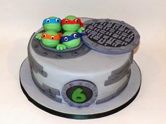 there is a cake that has two turtles on it