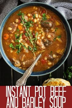 instant pot beef and barley soup in a blue bowl with a spoon on the side