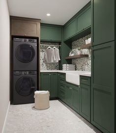 a washer and dryer in a green laundry room