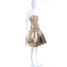 For Sale on 1stDibs - This is a fun vintage textured gold lurex strapless cocktail or party dress from the 1980's. The drop waist bodice is fully ruched and the skirt is lined Tulle Underskirt, Vintage Texture, Ruched Bodice, Gold Texture, Drop Waist, Vintage Dress, Vintage Dresses, Bodice, Evening Dresses