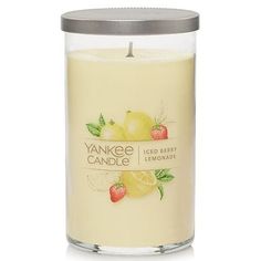 yankee candle with lemons and strawberries on the front, in a glass container